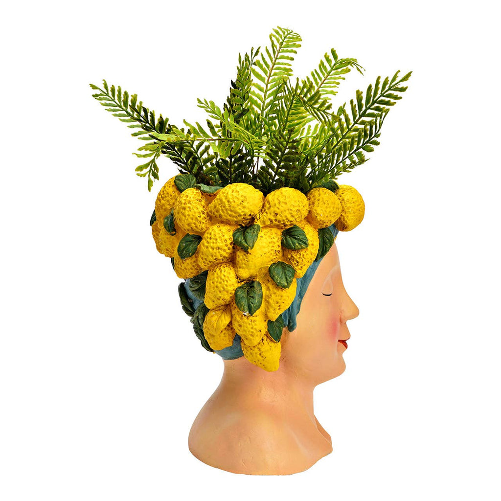 Maceta con forma de cabeza de mujer con limones